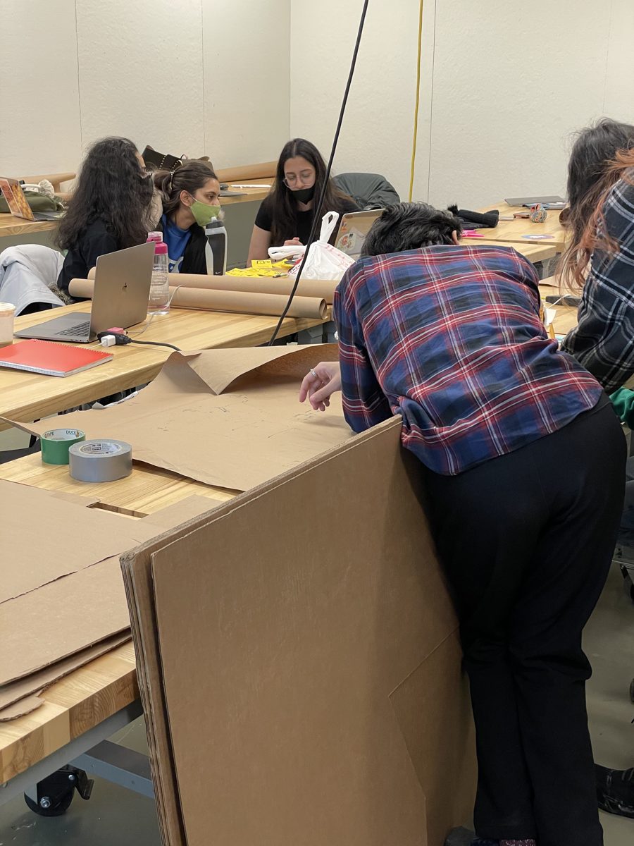 Students building prototypes from cardboard in the studio